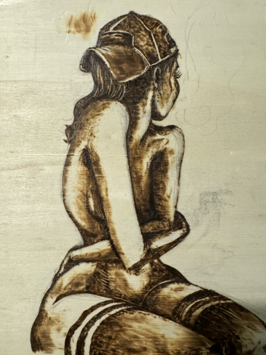 Wood burning of nude woman