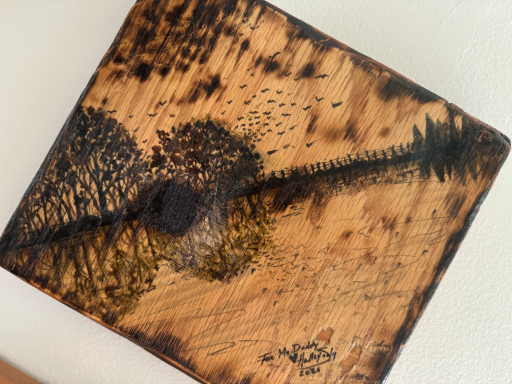wood burning landscape guitar scene