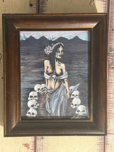 Nude witchy woman with skulls
